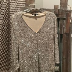 Silver, Sequin Shirt Never Worn. Perfect For New Year Celebration Or Christmas! Elegant V-neck Tops For Festive Occasions, Elegant V-neck Holiday Tops, Holiday Sequin Tops For Party Season, Holiday Party Sequin Tops, Christmas Sequin Tops, Long Sleeve Tops For Christmas Night Out, Elegant Festive Winter Tops, Fall Holiday Party Long Sleeve Tops, Chic Long Sleeve Tops For Holiday Party