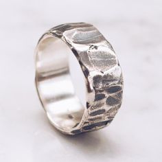 A textured Band Ring in 925 Sterling Silver with a unique raw textured and hammered finish. A stylish piece for both men and women. Available in Brass https://etsy.me/2U8LIgT Ring Size Available in all sizes. Please be sure to find your exact ring size for the finger you want before ordering. See image chart above or you can use the chart on my website as a guide - https://jewelrylab.co/pages/ring-sizing-tips Every piece is handcrafted in Bali and made with Intention, Love, and Soul so that it c Silver Snake Bracelet, Power Ring, Womens Ring, Hammered Ring, Hammered Rings, Ring Mens, Sterling Silver Rings Bands, Textured Ring, Mens Silver Rings