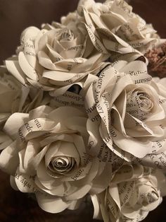 a bouquet of paper roses sitting on top of a table