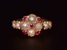 an antique ring with pearls and rubles