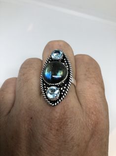 Huge blue green Labradorite rainbow moonstone and blue topaz Lovely vintage silver setting is low content silver Size 7.75 Can be re sized for you for $10 jeweler's fee About an inch long Ring is long covers from knuckle to knuckle. All rings are shipped in a nice gift box. Check out our over a THOUSAND great reviews Engraving is $4 per letter and is not always perfect depending on the piece. It can take a few days if the jeweler is busy. This is payable to Paypal Judithsltd@gmail.com Green Labradorite, Mermaid Ring, Long Ring, Silver Gift Wrap, Modernist Ring, Moonstone Stone, Statement Ring Silver, Silver Work, Rings Cool