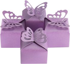 purple gift boxes with butterfly cutouts on them