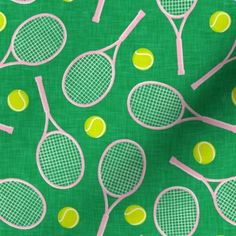 a green background with yellow and white tennis rackets on the same color as each other