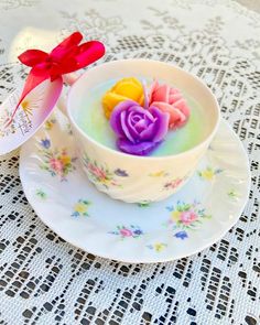 there is a cup with some flowers in it