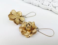 Gold Leather Rose Flower Earrings -Material - genuine leatherColor - soft goldSizes - flower diameter -3.5 cm or 1.4", hooks lenght is 3 cm or 1.2''Standard International Delivery from Latvia (Europe) via Latvijas Pasts to the U.S. usually takes about 10 - 20 business days.Thanks for looking! Adjustable Gold Flower Earrings, Gold Flower Earrings With Handmade Details, Adjustable Gold Jewelry With Handmade Flowers, Gold Flower Earrings With Lever Back, Gold Flower Earrings With Handmade Details For Party, Handmade Flower Drop Earrings In Gold, Handmade Flower Gold Earrings For Gift, Gold Flower Earrings With Handmade Flowers, Gold Earrings With Handmade Flowers As Gift