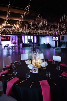 an empty ballroom with tables and chairs set up for a formal dinner or party event