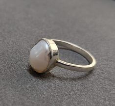 -PRODUCT TYPE - STERLING SILVER PEARL RING -MATERIAL - SILVER -PURITY - 925 -PEARL WEIGHT - 3.40 CARAT -SILVER WEIGHT - 925 - 1.540 GRAMS APPROX -TOTAL WEIGHT - 2.220 GRAMS APPROX 925 SILVER JEWELRY - We are Introducing this new collection of Silver jewelry which is distinctive and unique. We have used natural pearl stone of superb quality. So, here We launch this item on etsy! Minimal & Simple, 925 Sterling Silver Rings. Pearl Understated Luxury. - Delicate Silver ring. - Made to order, jus Sterling Silver Pearl Drop Ring, Handmade White Pearl Ring Fine Jewelry, Fine Jewelry Sterling Silver Pearl Ring With Oval Shape, Fine Jewelry Oval Pearl Ring In Sterling Silver, Oval Sterling Silver Pearl Ring, Oval Sterling Silver Pearl Ring In Fine Jewelry Style, Sterling Silver Rings With Pearl Drop, White Sterling Silver Rings With Pearl Drop, Oval Sterling Silver Pearl Ring With Gemstone