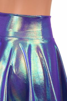 "This item is made to order, please read all the way through the listing before purchasing! This color shifting dual chrome skirt is a purplish blue with silver, fuchsia and green iridescence that is gorgeous when it moves! It has a stretchy waistband that sets up high at the natural waist. Choose from 10\", 12\" or 15\" lengths! The length shown is 15\" Matching crops and halter tops are also available in our shop! Need help choosing \"Length\"? Watch this video: https://www.youtube.com/watch?v Summer Party Skirt In Iridescent Color, Metallic Flared Skirt For Night Out, Shiny Metallic Skirt For Summer, Party-style Purple Flared Mini Skirt, Purple Flared Mini Skirt For Party, Purple Pleated Skirt For Party, Fitted Metallic Disco Skirt, Metallic Fitted Disco Skirt, Rave Skirt