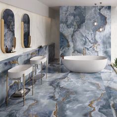 a bathroom with marble walls and flooring that looks like it has been painted blue