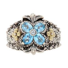 This ring is a size 7. Brand: Barbara Bixby Metal Content: Guaranteed Sterling Silver & 18k Gold as stamped Stone Information: Genuine Topaz Treatment: Routinely Enhanced (blue) Colors: Blue & White Cuts: Oval & Round Face Height (north to south): 23/32" (17.9mm) Rise Above Finger: 3/8" (9.2mm) Weight: 14.1 Grams Stamps: .925, 18, Bixby, China Yellow Stone Rings, Lotus Flower Ring, Pear Wedding Ring, Luxury Wedding Rings, Lotus Ring, Vintage Silver Rings, Diamond Heart Ring, Sterling Silver Rings Bands, Rise Above