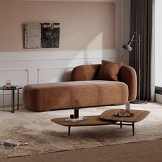 a living room with a couch, coffee table and lamp on the floor in front of a window