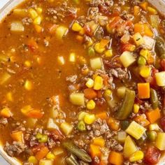 a white bowl filled with soup and vegetables