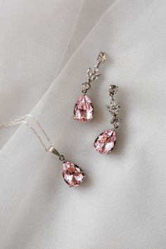 An absolutely stunning dusky blush pink colour teardrop jewellery set.  Simulated diamonds.  Standard 18 inch chain - other lengths available ie 16, 20 inch or add a 2 inch extension- please just add details to order notes otherwise standard 18 inch will be sent.  Earring length approx 1.5 inch.  Silver plated lead and nickel free. ( sterling silver chain )  Beautifully gift boxed Elegant Pink Jewelry Sets For Wedding, Delicate Pink Drop Jewelry, Pink Sterling Silver Jewelry For Wedding, Elegant Pink Sterling Silver Jewelry Sets, Elegant Pink Jewelry Sets For Formal Occasions, Delicate Pink Teardrop Jewelry, Pink Teardrop Pendant Jewelry For Wedding, Pink Teardrop Cubic Zirconia Jewelry, Pink Cubic Zirconia Teardrop Jewelry