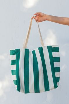 Verano is our new oversized beach bag. Made of an outdoor resistant canvas is perfect for your next sunny escapade. Not to mention the fun striped print, this bag was made for summer. Plenty of space to carry multiple towels, sunscreens, all your beach reads and more. It's lined with a light cotton canvas and comes with 2 inner pockets for your phone and wallet. It can also be customized to add a compartment for your yoga mat. Lightweight and easy to fold, toss it in your suitcase or use it as a Cheap Multicolor Bucket Beach Bag, Cheap Multicolor Beach Bag For Spring, Cheap Multicolor Beach Bag, Cheap Summer Canvas Bag For On-the-go, Cheap Summer Style Canvas Beach Bag, Cheap Multicolor Beach Bag For Market, Affordable Colorful Beach Bag For Daily Use, Cheap Summer Bag With Adjustable Strap, Cheap Summer Bags With Detachable Strap