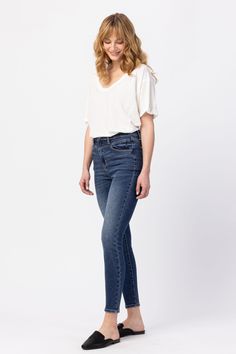 Judy Blue High Rise Front Yoke Skinny Denim 88364 Skinny fit: cut to be tight-fitting throughout the leg, from the thigh down to the ankle. Material: 94% Cotton, 5% Polyester, 1% SpandexFront Rise: 11"Inseam: 28.5"Model Info:Size: 1Height: 5'10Waist: 25"Hip: 36" Measured on the smallest size and may vary by size. Sizing Recommendation: We recommend sizing down one from your normal non-Judy Blue jean size. Contact us for any additional measurements or sizing. Front rise determines how high your p Judy Blue Jeans, Washed Jeans, Blue Jean, Jeans Style, Levi Jeans, Jeans Size, Tights, High Rise, Blue