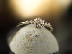 ❄️ Embrace winter elegance with this exquisite gold-plated snowflake ring, crafted from durable copper. The adjustable design ensures a comfortable fit for any finger size, making it a versatile and stylish accessory for both casual and formal looks. Add a touch of chic to your collection with this timeless piece. ✨ Copper Fashion, Snowflake Ring, Formal Looks, Jewelry For Women, Stylish Accessories, Timeless Pieces, Beauty Book, Jewelry Rings, Gold Plate