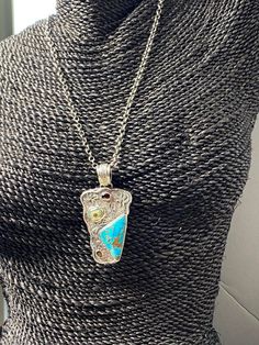 "ARTISAN KINGMAN TURQUOISE PENDANT Hand-made Sterling Silver 925. Stones used: Kingman Turquoise with Bronze, Garnet, Pearl. Height -2 5/8\" (including bail), Width - 1 7/16\" Height - 68mm (including bail), width-36mm. Unique Handcrafted One-of a-kind Design Pendant Each Piece of Jewelry in my Collection is Absolutely One of a Kind! When you start wearing a piece of my jewelry you will fall in love with it more and more each day and feel that good Energy and Love that I pass into it while creat Gold Turquoise Pendant Necklace In Sterling Silver, Artisan Sterling Silver Square Pendant Jewelry, Unique Sterling Silver Necklace With Rectangular Pendant, Artisan Rectangular Pendant Necklace As A Gift, Artisan Rectangular Pendant Necklace For Gift, Turquoise Pendant Necklace With Natural Stones, Turquoise Amulet Necklace With Round Pendant As Gift, Artisan Necklace With Rectangular Pendant As A Gift, Unique Teardrop Pendant Turquoise Necklace