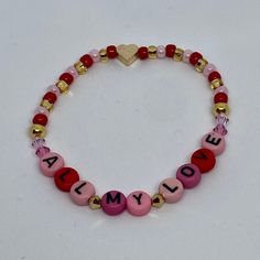 "Whether you are a Noah Kahan Stan or love Valentines Day, this \"Lover\" bracelet is for you!  \"All my love\" is made with assorted pink/red beads, or you may personalize to white beads with black letters (coin/round or cube). Bracelets are made with high quality seed beads and pre-stretched cord, with the knot glued and covered within the beads. While these bracelets are made to last, it is recommended that they are removed for swimming, showering, etc.  6.5 inches will fit most female wrists. Measure your wrist with a measuring tape or print a ruler online. Round up for a looser fit." Valentine's Day Heart Bracelet With Letter Beads For Friendship, Personalized Multicolor Beaded Bracelets For Valentine's Day, Customized Pink Friendship Bracelets For Mother's Day, Casual Heart Beads Bracelets For Valentine's Day, Valentine's Day Friendship Name Bracelet, Multicolor Letter Beads Bracelets For Valentine's Day, Multicolor Letter Beads Bracelet For Valentine's Day, Pink Name Bracelet For Friendship On Valentine's Day, Heart-shaped Letter Beaded Bracelets For Mother's Day