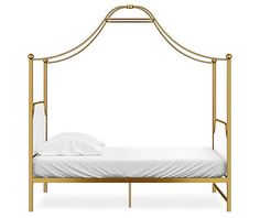 a gold metal bed with white sheets and pillows on it's sides, against a white background