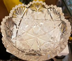 a glass bowl sitting on top of a table