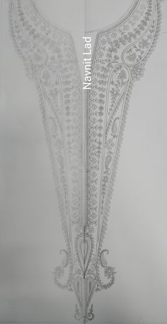 the back side of a white dress with intricate designs