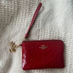 Never Used, Wristlet With Charms Red Wristlet With Removable Pouch As Gift, Red Wristlet With Zipper Closure As Gift, Red Wristlet Gift, Red Coach Wallet With Removable Pouch, Coach Red Wallet With Removable Pouch, Red Coach Clutch For Gift, Red Pouch Wallets With Wrist Strap, Red Coach Clutch As A Gift, Red Wristlet Clutch With Removable Pouch