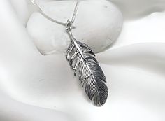 Sterling silver feather necklace, please choose your sterling silver chain style and length from the drop down menu The feather has been an important good luck symbol in many cultures, they can suggest ideas of flying or travel.  Feathers were used by ancient Egyptians, Celts and Native Americans to invoke the sky gods or celestial wisdom, and often symbolized communication with spirits. In Christianity, they have represented the virtues of faith, hope and charity. Some of the meaning for feathe Silver Feathered Sterling Silver Necklaces, Silver Sterling Silver Necklaces With Feathers, Silver Feather Pendant Jewelry, Luck Symbol, Silver Feather Necklace, Feather Pendant Necklace, Celebrity Jewelry, Ancient Egyptians, Sterling Silver Locket