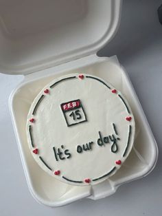 a cake in a foam container with the words it's our day written on it