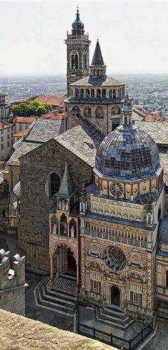 an aerial view of a large building with two towers