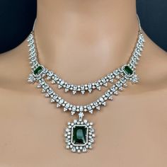 Emerald CZ diamond bridal necklace, American Diamond wedding necklace, Cz jewelry, Indian, Pakistani, and Punjabi wedding jewelry  Regular Size And Adjustable with rhodium finish Ships from California, USA Delivery in 2-5 business days in the USA. Other colors can be found here https://www.etsy.com/listing/1423096838/ruby-cz-diamond-bridal-necklace-american?ref=listings_manager_grid https://www.etsy.com/listing/1423097794/sapphire-cz-diamond-bridal-necklace?ref=listings_manager_grid Color, shade Exquisite Bridal Necklace With Cubic Zirconia Jewels, Diamond White Cubic Zirconia Bridal Necklace With Jewels, Diamond White Bridal Necklace With Cubic Zirconia, Wedding Diamond Necklace With Jewels In Cubic Zirconia, Emerald Cut Diamond Jewelry For Wedding, Wedding Diamond Necklace With Cubic Zirconia, Wedding Cubic Zirconia Diamond Necklace, Emerald Cut Diamond Accented Wedding Jewelry, Emerald Cut Diamond Wedding Jewelry With Accents