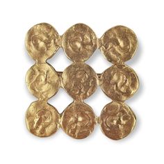 six gold coin pieces with faces on them