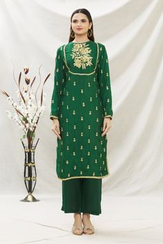 Marshy green kurta with thread and sequin floral embroidery. Comes with pant and dupatta.
Component: 3
Pattern: Embroidery
Type Of Work: Thread and Sequin
Neckline: Round
Sleeve Type: Full
Fabric: Chanderi
Color: Green
Other Details: 
Dupatta with scalloped border
Side slits
Cutout detail at the neckline
Keyhole back
Closure: Loop back button
Occasion: Puja - Aza Fashions Zari Work Straight Kurta Palazzo Set For Reception, Straight Kurta Palazzo Set With Zari Work For Reception, Resham Embroidery Palazzo Set For Reception, Festive Unstitched Palazzo Set, Festive Palazzo Set With Dabka Work For Reception, Bollywood Palazzo Set With Straight Kurta For Reception, Reception Straight Kurta Palazzo Set In Chinon, Festive Semi-stitched Palazzo Set With Dori Work, Pista Green Straight Kurta Sets For Reception