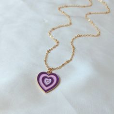 Don't miss out on this beautiful gold plated and purple retro heart necklace. They work with a large variety of looks and add a bit of sparkle to your outfit. MORE jewellery pieces avaliable on our shop! Any questions please message we are happy to help. Free postage in UK Thank you for shopping with us Heather&Bumble 📪Follow us at: Instagram: heatherandbumble Twitter: Heather_Bumble Pintrest: Heather & Bumble Purple & Gold Retro Heart Necklace -  70's Style Necklace, Vintage Style, Hanging Jewellery, Accessories, Purple Jewellery, Gold Necklace Retro Heart-shaped Necklace For Gift, Retro Heart-shaped Necklace Gift, Retro Purple Jewelry For Gifts, Retro Heart-shaped Jewelry Gift, Purple Double Heart Charm Jewelry, Purple Double Heart Jewelry With Heart Charm, Purple Double Heart Jewelry For Valentine's Day, Retro Heart-shaped Jewelry For Valentine's Day, Purple Heart Necklace For Valentine's Day