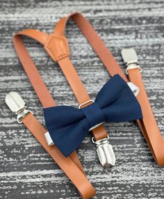 Classic Fitted Suit And Tie Accessories With Suspenders, Elegant Blue Adjustable Bow Tie, Classic Suspenders For Black Tie Events, Classic Suspenders For Suit And Tie At Party, Dapper Summer Party Suit And Tie Accessories, Fitted Suspenders For Groom Suit And Tie Accessories, Elegant Suspenders For Party Suit Accessories, Blue Dapper Suit And Tie Accessories For Party, Classic Formal Belts And Suspenders For Summer