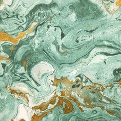 an abstract marble pattern with gold and green accents on it's surface, as well as the colors