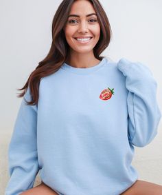 Cute Strawberries Sweater for all Strawberry-lovers! This sweatshirt feels cozy and comfortable. * PRODUCTION TIME *  1-5 days (Usually 2-3 days) * SHIPPING TIME *  2-5 days (Usually 3 days) * PRODUCT DESCRIPTION *  Unisex Gildan 18000 Crewneck Sweatshirt Made with a medium-heavy fabric blend of 50% cotton and 50% polyester (8.0 oz/yd² (271.25 g/m²) Made using 100% ethically grown US cotton.  Fabric blends: Heather Sport colors - 60% polyester, 40% cotton For Sweatshirt Sizes - Please refer to the Listing Image. * CARE INSTRUCTION *  Machine wash: cold (max 30C or 90F) Non-chlorine: bleach as needed Tumble dry: low heat Do not iron Do not dryclean. Cute Relaxed Fit Hoodie With Crew Neck, Casual Long Sleeve Tops With Strawberry Print, Strawberry Hoodie, Strawberry Sweater, Berry Good, Strawberry Shirt, Cute Strawberry, Heavy Fabric, Crewneck Sweatshirt