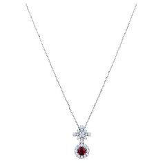 This necklace features a 0.57 carat natural round ruby accented by 0.52 carat in round natural diamonds set in 18 karat white gold. It is set on an 18 karat white gold 16" chain. Lobster clasp closure. Luxury Red Diamond Round Necklace, Fine Jewelry Ruby Diamond Necklace In Red, Red Ruby Round Necklaces, Ruby And Diamond Necklace 1stdibs, Luxury Brilliant Cut Ruby Necklace, Round Diamonds, Natural Diamonds, Diamond Necklace, Ruby