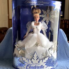 a barbie doll in a white dress with snowflakes