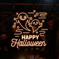 a neon sign that says happy halloween