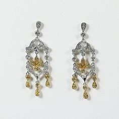 Bring dramatic sparkle to your look with these stunning chandelier earrings featuring a three strands design displaying 10 brilliant diamonds - .03 ct. tw. They are beautifully designed in gleaming 14k white and yellow gold (3.89g total weight) for a look of timeless luxury.  Excellent condition. Stunning Chandelier, Timeless Luxury, Gold Chandelier, Drop Dangle Earrings, Brilliant Diamond, Wedding Earrings, Chandelier Earrings, Favorite Jewelry, Jewelry Earrings Dangle