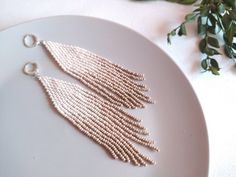 Check out this item in my Etsy shop https://www.etsy.com/listing/929426331/long-beige-ivory-ombre-earrings-gradient White Fringe Chandelier Dangle Earrings, Elegant White Fringe Earrings, White Beaded Fringe Long Drop Earrings, White Bohemian Fringe Earrings, Beige Bohemian Fringe Earrings, Feminine Earrings, Funny Earrings, Ombre Earrings, Boho Style Earrings