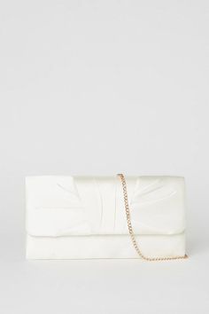 Elegant satin clutch bag with a sleek, minimalist design
Sophisticated chain strap for versatile carrying options
Structured silhouette with a secure clasp closure
Spacious interior compartment for essentials
Lustrous satin fabric exudes a luxurious sheen
Crafted with meticulous attention to detail, this satin clutch bag from Coast is the epitome of refined style. Its clean lines and lustrous fabric make it the perfect accompaniment for formal occasions like weddings or evening events. Carry it as a chic clutch or drape the chain strap over your shoulder for a hands-free look that radiates elegance. Whether paired with a flowing gown or a tailored cocktail dress, this versatile accessory will elevate your ensemble with its timeless sophistication. Flowing Gown, Satin Clutch, Bridal Bag, Sequin Outfit, Bridal Clutch, Satin Bags, Bags Purses, Boots For Sale, Jeans For Sale