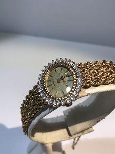 "What a beautiful way to wear the time. This stunning watch is in 14 kt solid gold case and matching mesh style 14kt bracelet band, custom made to fit a 6.5\" wrist with a safety chain as well as a safety clasp. The watch bezel is studded with diamonds that have a total carat weight of over 1 ct. This watch is a quartz style with minimal maintenance as it only needs to have a battery replacement every few years. The watch and matching band are heavy and well made weighing over 34 grams." Yellow Gold Diamond Jewelry And Watches As Gift, Gold Diamond Jewelry And Watches For Evening, Diamond Yellow Gold Jewelry As Gift, Luxury Gold Watches Stamped 14k, Gold Evening Watch With Jubilee Bracelet, Luxury 14k Gold Jewelry And Watches, Gold Diamond Watch For Evening, Elegant 14k Gold Watches For Formal Occasions, Anniversary Diamond Jewelry In Yellow Gold