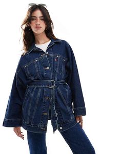 Upgrade your wardrobe with this belted dolman oversized denim trucker in dark blue. Combining timeless style and comfort, this versatile jacket adds a relaxed yet trendy touch to any outfit. Perfect for layering over casual looks or pairing with your favorite jeans.