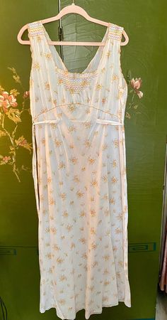 Stunning 1940's floral floor length nightgown with hand embroidery! This lovely gown is made with the softest cotton, light as air- It would look equally beautiful as a summer dress! Good Vintage Condition, slight damage in the stitching at the belt, please see photos. Would best fit a size Medium to Large, please see measurements below. Measurements (taken on garment lying flat, double when appropriate): Underarm to underarm: 21" Length: 56" Waist: 19" (unbelted) Label: "Guaranteed Hand Made" Womens Nightgowns, Floral Floor, Cotton Nightgown, Women's Nightgowns, Pajama Robe, Nightgowns, Festival Season, Night Gown, Summer Dress