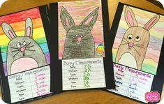 three children's handmade bunny and rabbit measurement cards on a wooden table with colored pencils