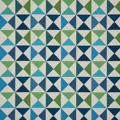 a blue and green rug with triangles on it