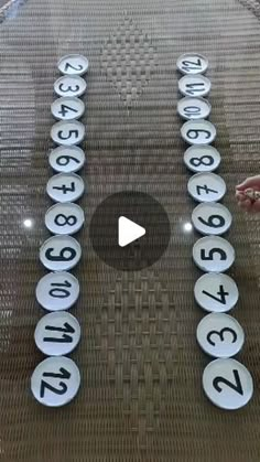 a person pointing at numbers on a glass table