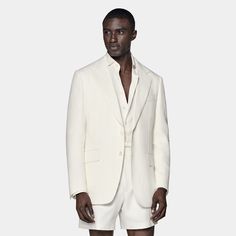 This two-button off-white blazer is cut to our tailored fit with a slightly widened notch lapel, sleek jetted pockets, and a structured shoulder. Luxury White Blazer For Business Casual, Cream Notch Lapel Sport Coat For Business, White Single Breasted Suit With Suit Collar, White Single-breasted Suit With Suit Collar, White Tuxedo With Pressed Crease For Semi-formal, Luxury White Business Casual Outerwear, Luxury White Outerwear For Business Casual, Tailored White Tuxedo With Hidden Buttons, Luxury White Suit With Notch Lapel