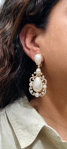 "Dive into the timeless elegance of Kundan Jhumka/Jhumki and Diamond earrings, reflecting the rich heritage of Indian and Pakistani Jewelry, adorned with the glamour of Bollywood. Discover your perfect pair ✨💎. Explore an array of designs and varieties by visiting my Etsy shop for an extensive collection 🛍️:    https://thefashionofindia.etsy.com"earrings bridal earrings Bollywood statement jewelry Teardrop Pearl Clip-on Earrings, Teardrop Pearl Clip-on Jewelry, Clip-on Teardrop Pearl Jewelry, Clip-on Dangle Pearl Earrings, Pearl Clip-on Drop Earrings, Clip-on Pearl Drop Earrings, Clip-on Drop Pearl Earrings, Bridal List, No Piercing Earrings